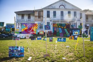 Art created by Camp Jabberwocky's campers hung in front of the Marine Hospital in Vineyard Haven Friday afternoon. - Sam Moore