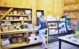 Dana Jacobs pays for her goodies using the farm’s honesty box in the farmstand.